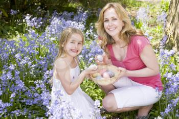 Royalty Free Photo of a Mother and Daughter Looking for Eggs