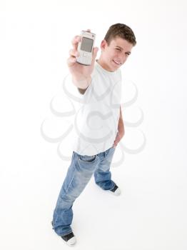 Royalty Free Photo of a Teenage Boy Holding a Cellphone