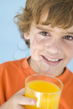 Royalty Free Photo of a Boy With Juice
