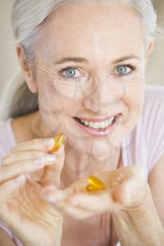 Royalty Free Photo of a Woman With Capsules