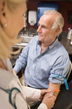 Royalty Free Photo of a Man Having a Blood Test Done