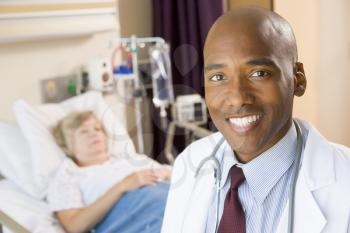 Royalty Free Photo of a Doctor in a Patient's Room