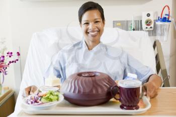 Royalty Free Photo of a Woman in the Hospital With a Food Tray
