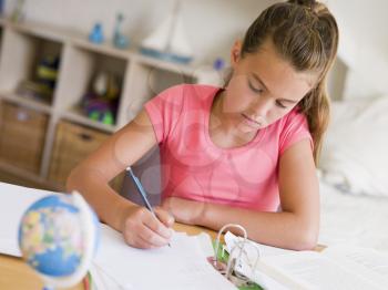 Royalty Free Photo of a Girl Doing Her Homework