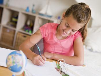 Royalty Free Photo of a Girl Doing Her Homework