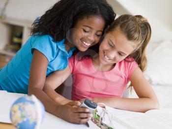 Royalty Free Photo of Two Girls With a Cellphone