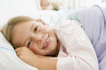Royalty Free Photo of a Girl in Bed