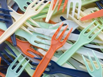 Royalty Free Photo of a Pile of Coloured Plastic Forks