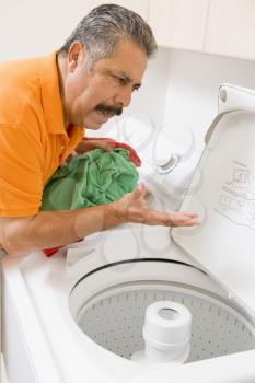 Royalty Free Photo of a Man Doing Laundry