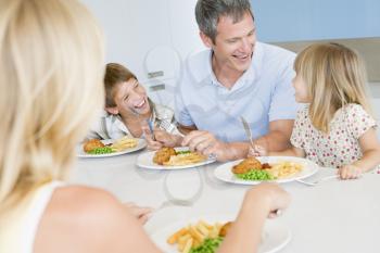 Royalty Free Photo of a Family Eaten a Meal