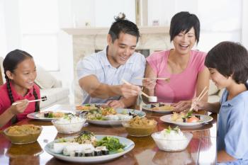 Royalty Free Photo of a Family Enjoying a Meal