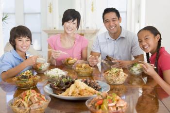 Royalty Free Photo of a Family Enjoying a Meal