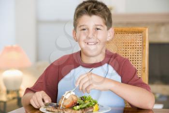Royalty Free Photo of a Boy Eating