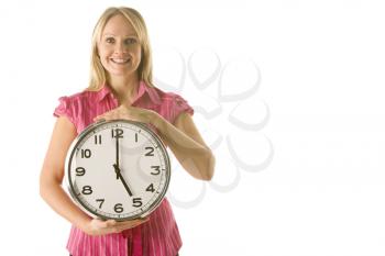 Royalty Free Photo of a Woman Showing a Clock
