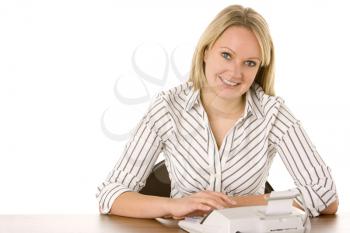 Royalty Free Photo of a Woman Using an Adding Machine