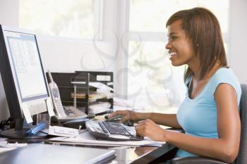 Royalty Free Photo of a Girl Using a Computer