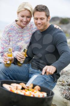 Royalty Free Photo of a Couple Barbecuing