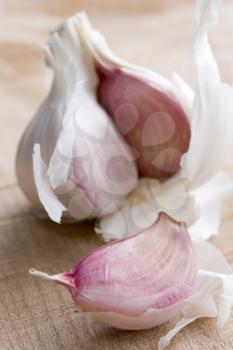 Royalty Free Photo of a Clove of Garlic and Bulb