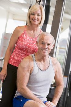 Royalty Free Photo of a Man and Woman at a Gym