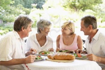 Royalty Free Photo of Friends Eating Outside