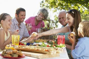 Royalty Free Photo of a Family Dining Outside