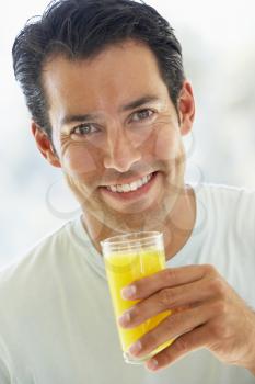Royalty Free Photo of a Man Drinking Juice