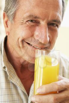 Royalty Free Photo of a Man With Juice