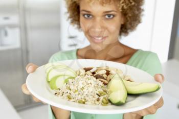 Royalty Free Photo of a Woman With a Plate of Healthy Food