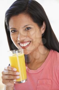 Royalty Free Photo of a Woman Drinking Orange Juice