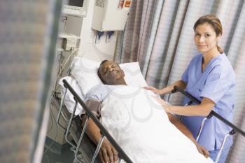 Royalty Free Photo of a Woman Caring for a Patient