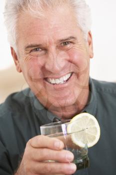 Royalty Free Photo of a Man Having a Drink