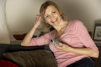 Royalty Free Photo of a Woman Watching TV