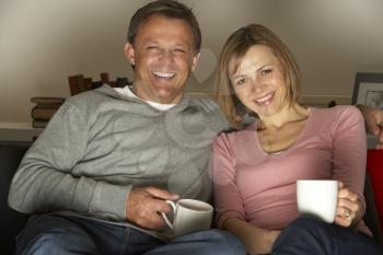 Royalty Free Photo of a Man and Woman Watching TV