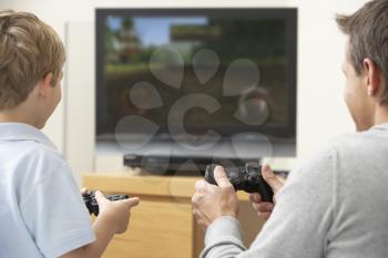 Royalty Free Photo of a Father and Son Playing Video Games