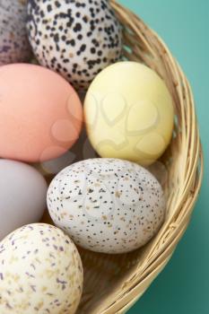 Royalty Free Photo of Colourful Eggs in a Basket