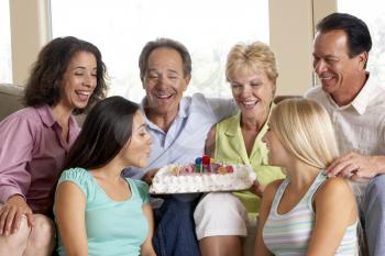 Royalty Free Photo of Two Families Celebrating a Birthday