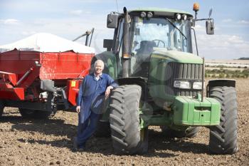 Royalty Free Photo of a Man With a Tractor