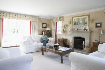 Royalty Free Photo of a Woman in a Living Room