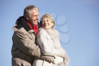 Royalty Free Photo of a Couple Embracing Outside