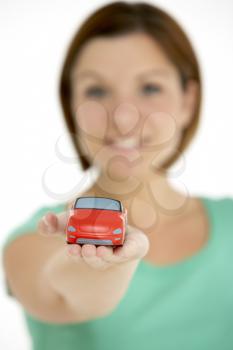 Royalty Free Photo of a Woman Holding a Car