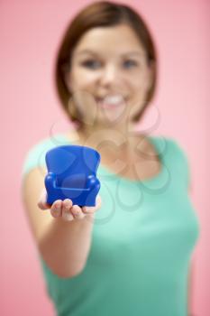 Royalty Free Photo of a Woman Holding a Small Armchair