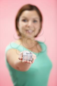 Royalty Free Photo of a Woman Holding a Small Gift