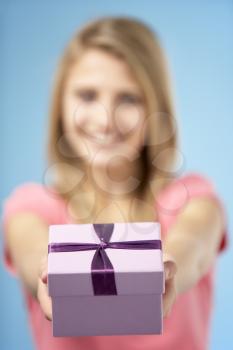 Royalty Free Photo of a Girl With a Wrapped Box