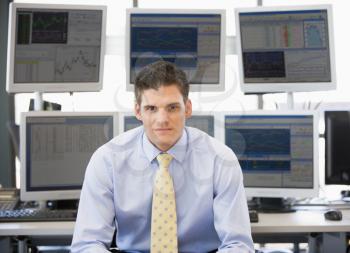 Royalty Free Photo of a Stock Trader in Front of Monitors