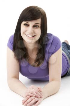 Royalty Free Photo of a Girl Lying on the Floor