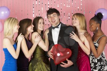 Royalty Free Photo of Girls With a Boy at the Formal