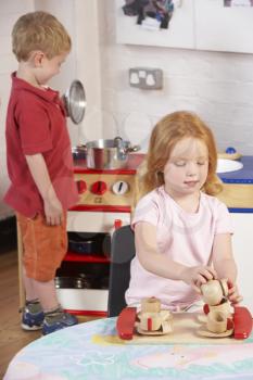 Royalty Free Photo of Two Children Playing at Preschool