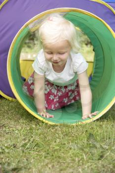 Royalty Free Photo of a Little Child on a Playground Toy