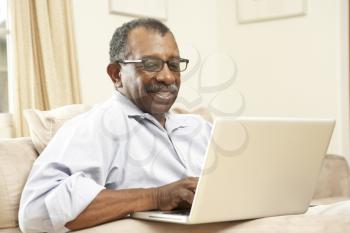 Royalty Free Photo of a Man With a Laptop