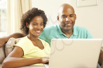 Royalty Free Photo of a Couple With a Laptop